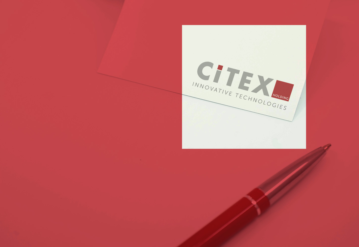 Nahaufnahme eines Kugelschreibers und Visitenkarte mit Citex-Branding